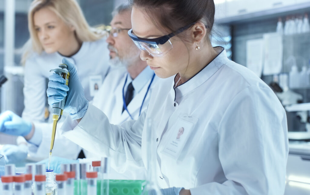 A female scientist doing drug batch testing on OTC drugs